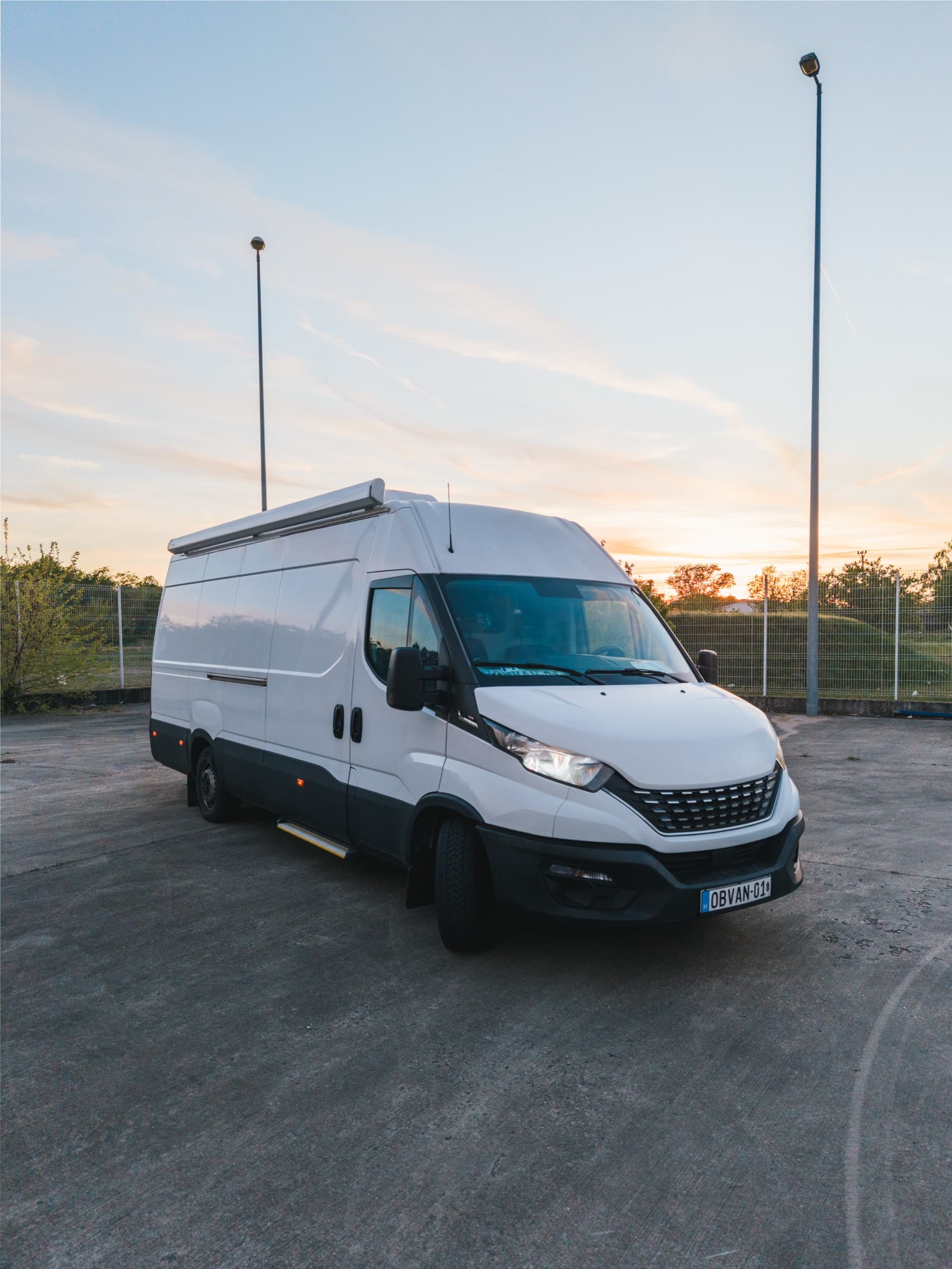 Noon Vision OB-1 outside broadcast van parked at sunset
